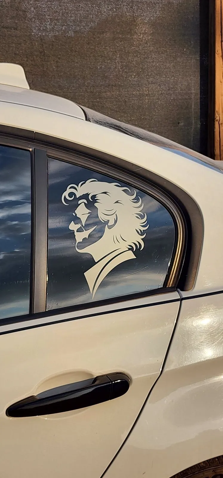 Custom portrait vinyl decal on a car window
